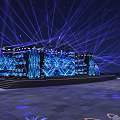 Large Stage With Blue Lighting Big LED Screen And White Seats For Live Event Setup
