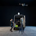 Black Mercedes-Benz Utility Van With Open Door Roof Equipment Drone And Nearby Person