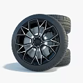 Car Tire with Black Geometric Alloy Wheel and Tread Pattern Design
