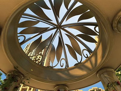 Ornate Circular Metal Ceiling With Leaf Patterns And Columns Against High Rise Buildings 3d model