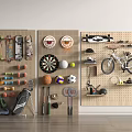 Organized Sports Equipment on Wall Mounted Pegboard with Skateboards Darts Basketball Volleyball and Bicycle