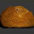 Freshly Baked Golden Bread With Cracked Crusty Surface On Black Background