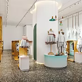Modern Stylish Clothing Store Interior With Mannequins Hanging Clothes And Decorative Lights
