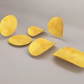 Golden Crunchy Potato Chips in Different Shapes Scattered on Gray Surface