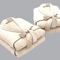 Two Folded Beige Bathrobes With Belt Tied Into Bow Against Light Blue Background
