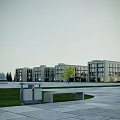 Modern Beige Office Building With Large Glass Windows And Landscaped Trees Shrubs
