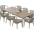 Wooden Dining Table Set With Eight Gray Cushioned Rattan Chairs And Decorative Vase On Tabletop