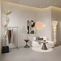 Modern Clothing Store Interior Design With Clothing Rack Sofa Floor Lamp And Wall Art