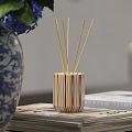 Decorative Ornament Set With Striped Diffuser Yellow Reed Sticks Blue White Vase And Purple Flowers
