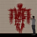 Red Linear Sculpture Abstract Human Figure Form In Modern Interior Space With Person Appreciating