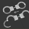 Two Stainless Steel Handcuffs With Key In Open And Closed States