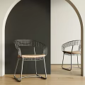 Modern Metal Frame Dining Chairs With Curved Design And Light Colored Seat In Arched Interior