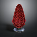 Red Teardrop Shaped Chair With Diamond Tufted Buttons And Transparent Base