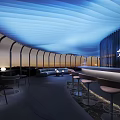 Modern Restaurant Interior With Blue Flowing Ceiling Light And Curved Design