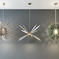 Three Modern Pendant Lights Featuring Spiky Leaf Shaped Honeycomb Textured Green Glass on Gray Wall