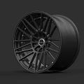 Black Alloy Car Wheel With Sporty Spoke Design And Hub Detail