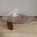 Modern Round Coffee Table With Glass Top Wooden Base And Decor Items