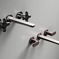 Modern Wall Mounted Faucets Featuring Brushed Metal and Bronze Handles in Contemporary Bathroom Design