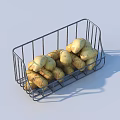 Fresh Organic Potatoes Placed in Metal Wire Basket on White Surface