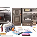 Vintage Electronic Devices Collection With Cassette Tapes Headphones Pencils And Figurines