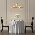 Elegant Dining Table Set with White Tablecloth Vase White Flowers Black Chairs and Branch Chandelier