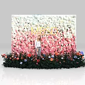Colorful Floral Wall With VOGUE Lettering And Person Standing In Front