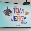 Projection Monitoring Screen Showing Tom And Jerry Show With Clear Content