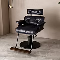 Minimalist Black Leather Armchair with Metal Frame and Wooden Footrest in Indoor Space