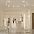 Modern Clothing Store Interior With White Reception Desk Clothing Racks Mannequin And Green Plants
