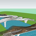 Multiple Landscape Bridges With Modern Curved Designs Spanning Blue Water Surface And Green Areas