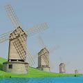 Row of Traditional Wooden Windmills With Large Rotating Blades Stone Bases and Green Hillside