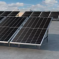 Solar Panel Array Arranged On Rooftop Under Blue Sky With White Clouds 3d model
