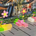 Vibrant Flower Shaped Art Installations With Colorful Block Planters In Mall Atrium