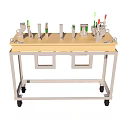 Industrial Equipment Workbench With Wheels Featuring Green Mechanical Components And Indicator Lights
