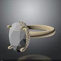 Elegant Ring With Oval White Gemstone And Small Diamond Accents On Golden Band
