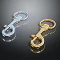 Shiny Silver And Gold Decorative Metal Hooks On Black Reflective Background