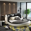 Round Double Bed Modern Bedroom With Black White Headboard Pillows Striped Blanket Colorful Rug