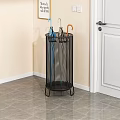 Black Metal Mesh Storage Rack For Umbrella Storage In Corner Near Doorway With Sturdy Design
