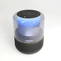 Harman Kardon Bluetooth Speaker with Transparent Cylinder Design Blue Illumination and Black Mesh Base Modern Audio Device