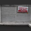 Sales Office Building Exterior Featuring Roller Shutter And Commercial Space For Rent