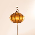 Golden Striped Lantern With Warm Light On Floor Standing Pole In Soft Background