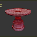 Pink Round Pedestal Table With Modern Smooth Surface And Decorative Base