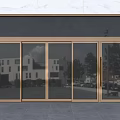 Gold Frame Glass Panels Entrance Door With Marble Wall And Reflections Of Buildings Trees Vehicles
