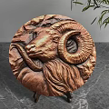 Copper Circular Decorative Ornament Set With Ram Head Carving Stone Texture On Marble Tabletop