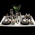 Elegant Decorative Ornament Set With Silver Gold Dinnerware Vase Wine Glasses Green Plant Marble Tabletop