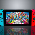 Portable Game Console With Blue Red Controllers Displaying Super Smash Bros Vibrant Graphics