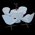 Modern Round Table And Chairs Set With White Tablecloth Pink Flowers Vase And Metal Legs