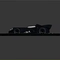 Black Batmobile Style Car with Sleek Design Parked on Circular Platform