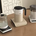 Three Modern Electric Kettles With Sleek Design On Wooden Table For Daily Use