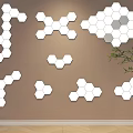 White Hexagonal Decorative Lights Arranged On Brown Wall With Green Plant 3d model